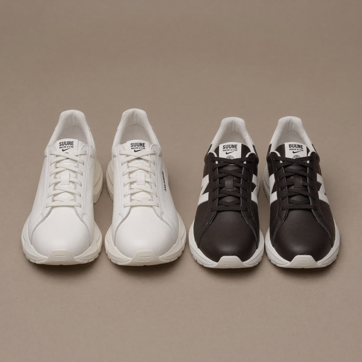 chunky-vs-slim-sneaker-comparison - The Tall Take A bulky chunky white sneaker beside a slim low-profile dark retro running sneaker