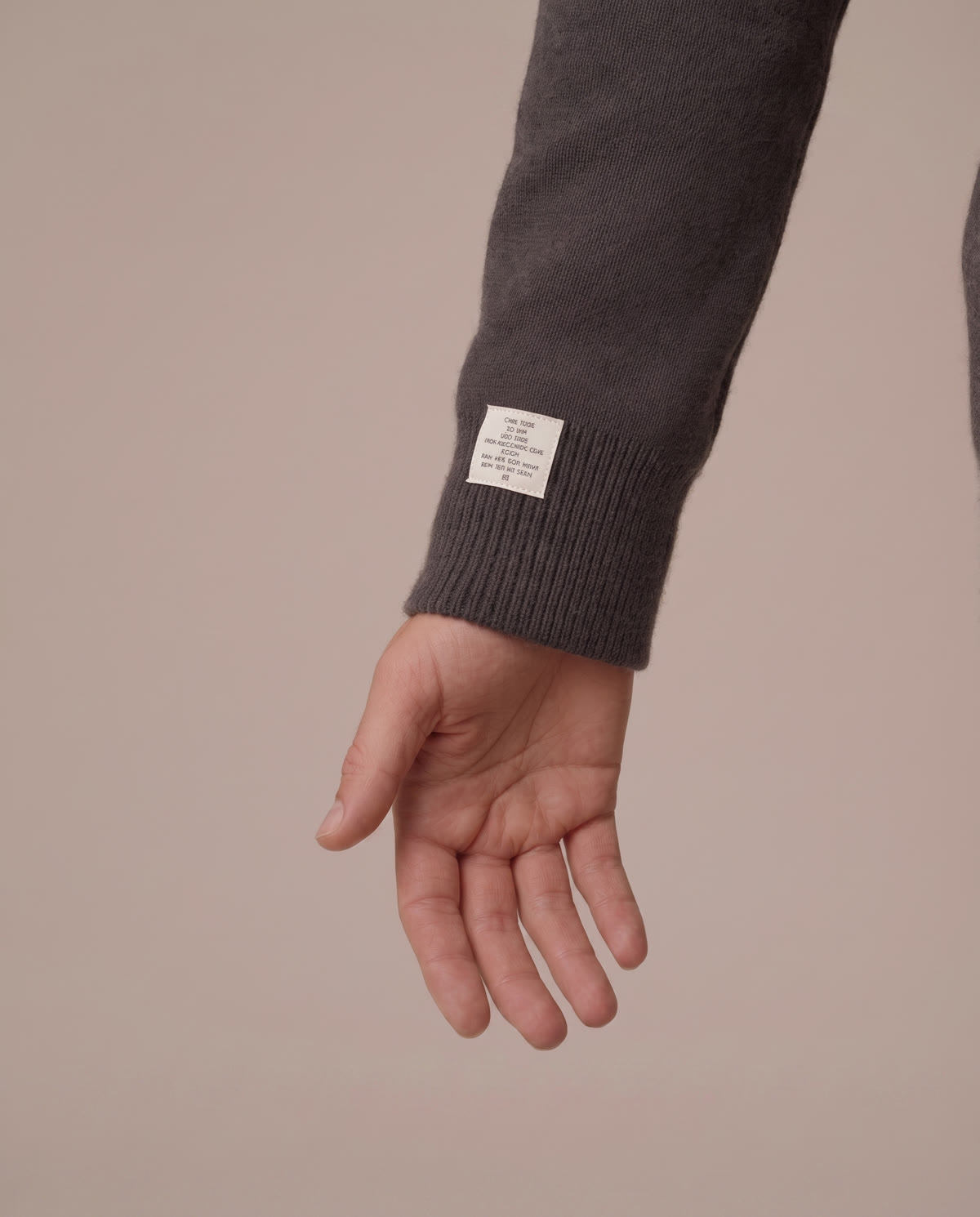 tall-layering-sleeve-wrist-bone - The Tall Take Close-up of a knit sleeve cuff ending at the wrist bone
