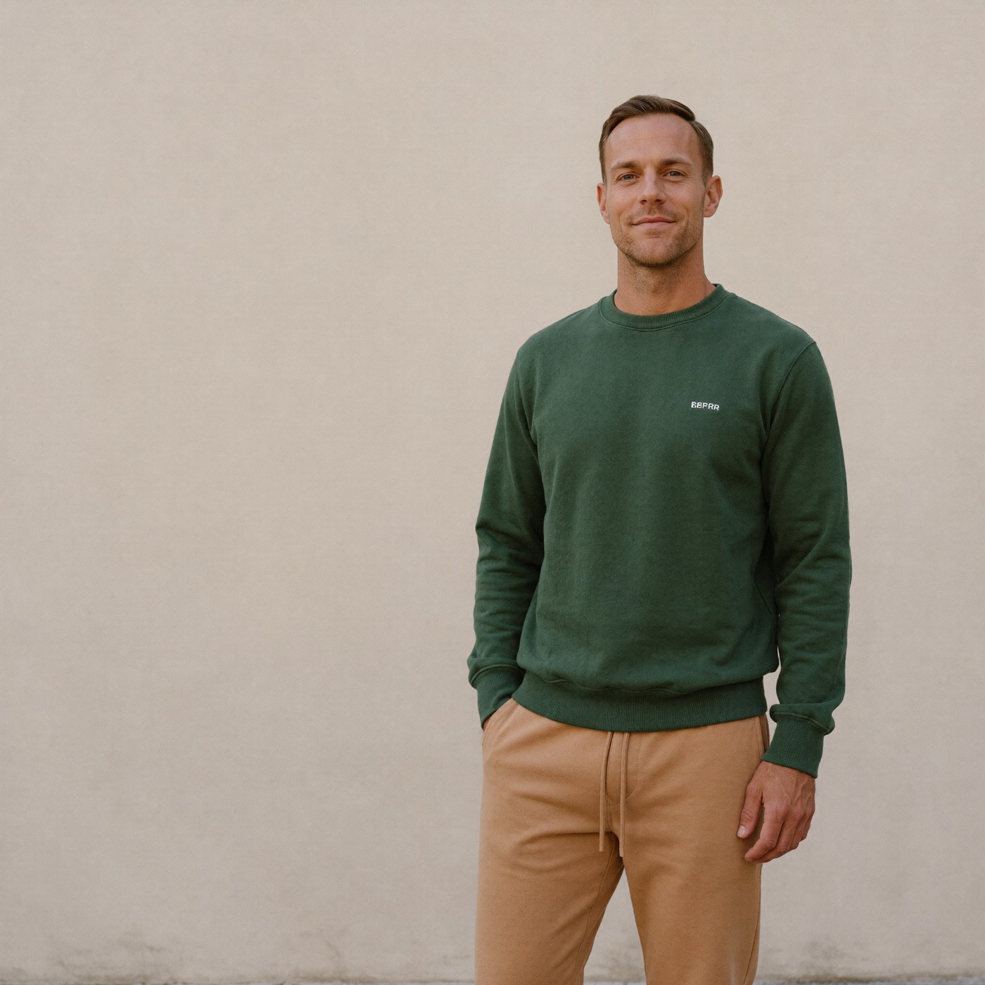 tt-jogger-full-look - The Tall Take Tall man wearing camel jogger sweatpants and a forest green crewneck sweatshirt